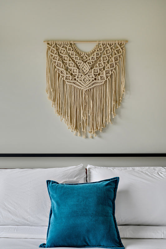 This large scale macrame wall hanging is perfect addition to your home. Hang over your bed, in the living room, entry way or any interior wall space in need of a statement and texture. 