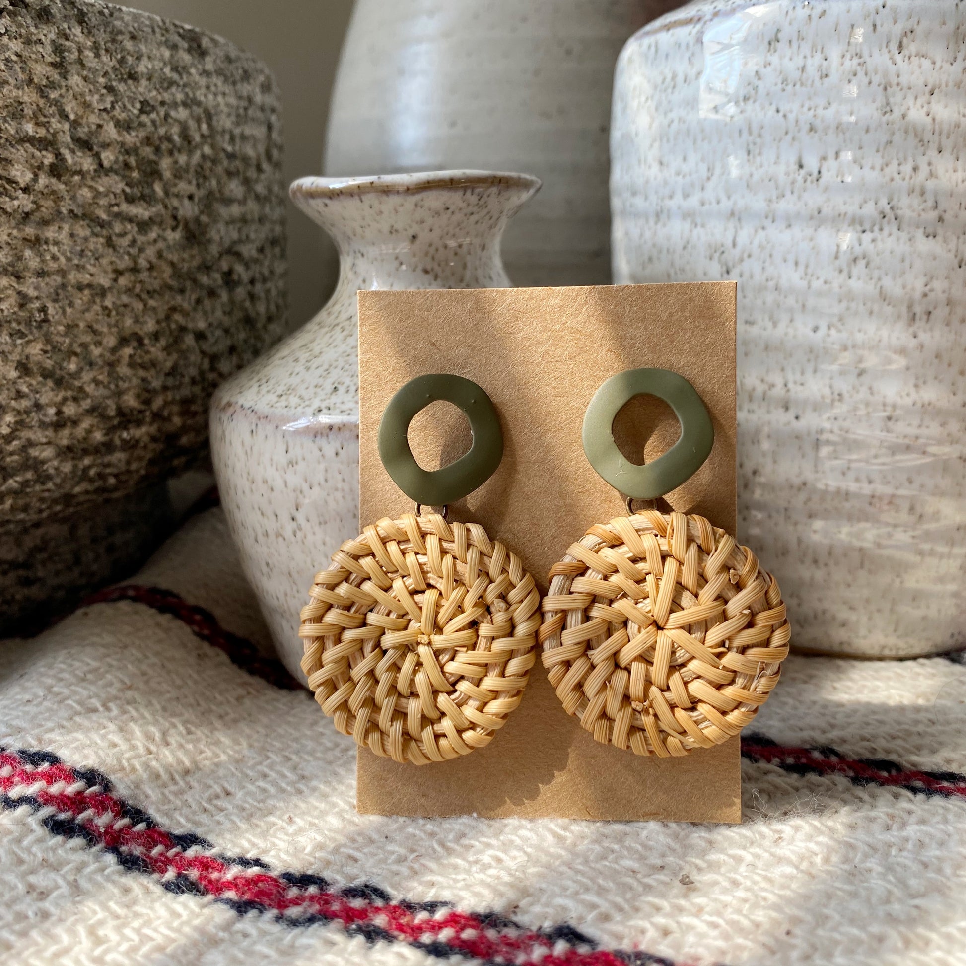 Handmade, natural, and lightweight statement earrings. These rattan drop earrings are perfect for a special occasion or casual everyday wear. Available in a variety of accent colors to pair with any style!