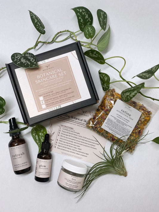 Botanical skincare set for an organic, plant-based, herbal infused at home facial. Kit includes a botanical face oil, a floral toner, an herbal clay mask, and a botanical face steam pack. All products are handmade, small batch, non-toxic, and plant based. 