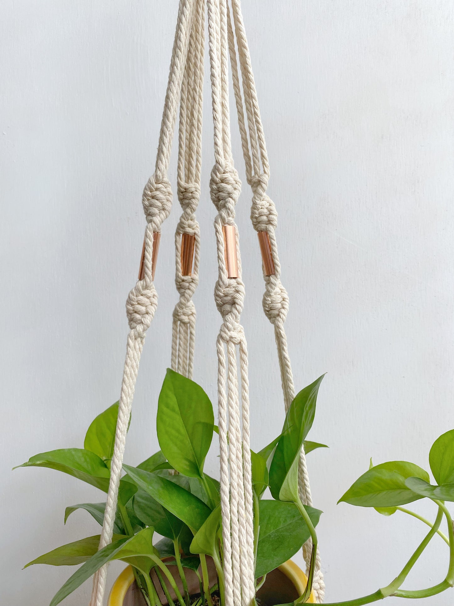 Create more space in your home and suspend your urban jungle with a ready to hang, handmade, boho macrame plant hanger. Designed with copper accents to compliment your chosen pot and add an industrial element to this boho home decor. Choose from 2 styles! Great for indoors or outdoors, just add your favorite plant! 