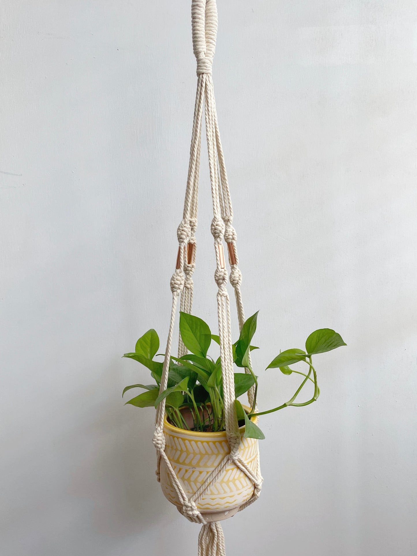 Create more space in your home and suspend your urban jungle with a ready to hang, handmade, boho macrame plant hanger. Designed with copper accents to compliment your chosen pot and add an industrial element to this boho home decor. Choose from 2 styles! Great for indoors or outdoors, just add your favorite plant! 