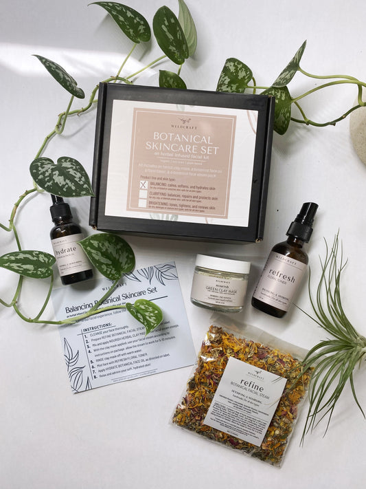 Botanical skincare set for an organic, plant-based, herbal infused at home facial. Kit includes a botanical face oil, a floral toner, an herbal clay mask, and a botanical face steam pack. All products are handmade, small batch, non-toxic, and plant based.